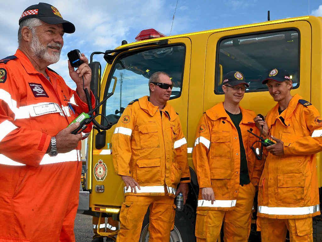 TESTING, ONE, TWO: SES Volunteer Alan Beaver radios Rural Fire Brigade volunteers Adam Avery, Cameron Young and Jonathon Rock. TESTING, ONE, TWO: SES Volunteer Alan Beaver radios Rural Fire Brigade volunteers Adam Avery, Cameron Young and Jonathon Rock.